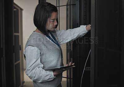 Buy stock photo Tablet, server room and engineering with a programmer asian woman at work on a computer mainframe. Software, database and information technology with a female coder working alone on a cyber network