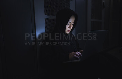 Buy stock photo Hacker, server room and person on laptop for coding software, data center crime and cyberpunk in dark. Network hacking, woman or user in cybersecurity, information technology or programmer ransomware