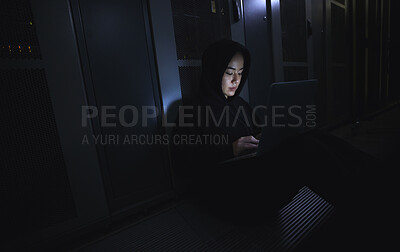 Buy stock photo Hacking, laptop and hacker woman in dark server room for coding software, data center crime or cyberpunk intel. Network criminal, person or user in cybersecurity, information technology or ransomware