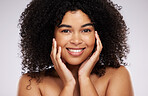 Portrait, beauty and afro with a model black woman in studio on a gray background for natural hair treatment. Face, skincare and haircare with an attractive young female posing to promote cosmetics