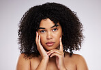 Dermatology, cosmetics and facial portrait of black woman with hand on face, afro and advertising luxury makeup. Skincare, beauty and skin care product promo on model isolated on studio background.