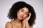 Beauty, cosmetics and portrait of black woman with hand on face, afro and advertising luxury makeup product promo. Dermatology, skincare and spa facial care on model isolated on studio background.