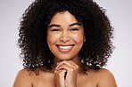 Portrait, face and afro with a model black woman in studio on a gray background for natural hair treatment. Beauty, skincare and haircare with an attractive young female posing to promote cosmetics