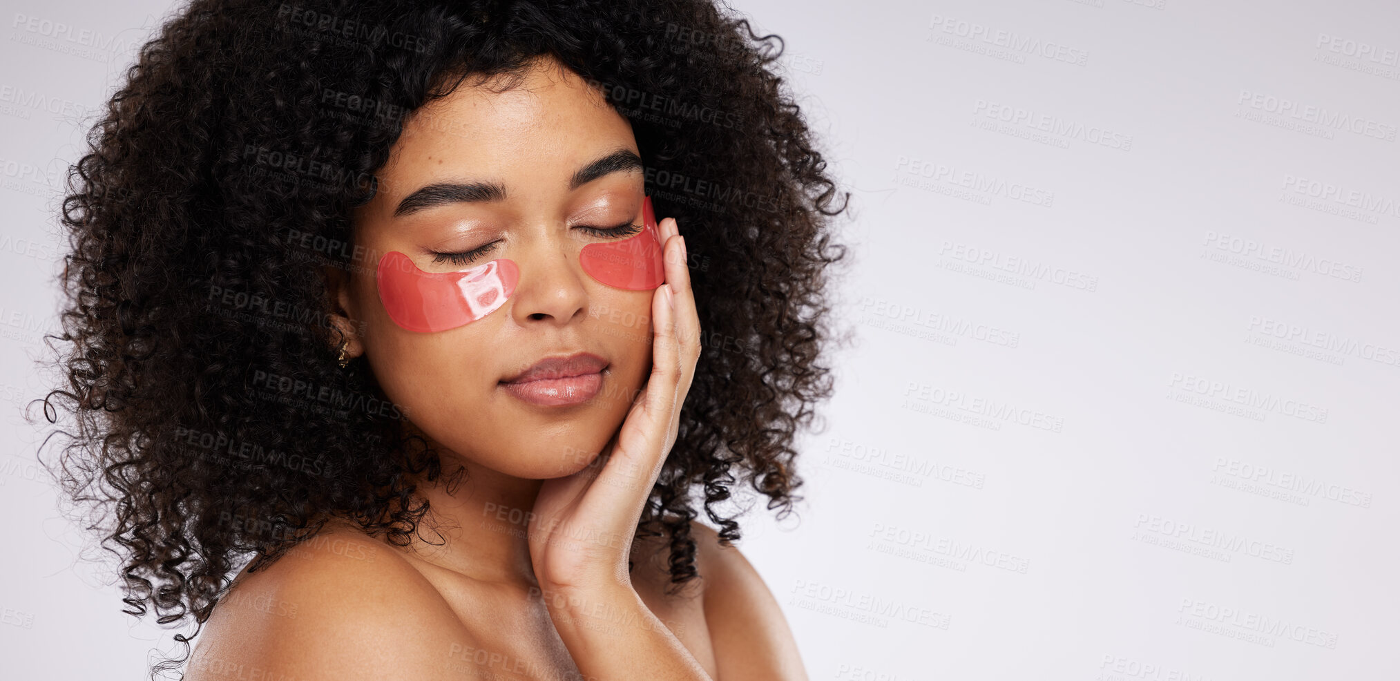 Buy stock photo Eye mask, skincare and mockup with a model black woman in studio on a gray background for beauty or cosmetics. Spa, relax and facial with an attractive young female posing beside mock up space