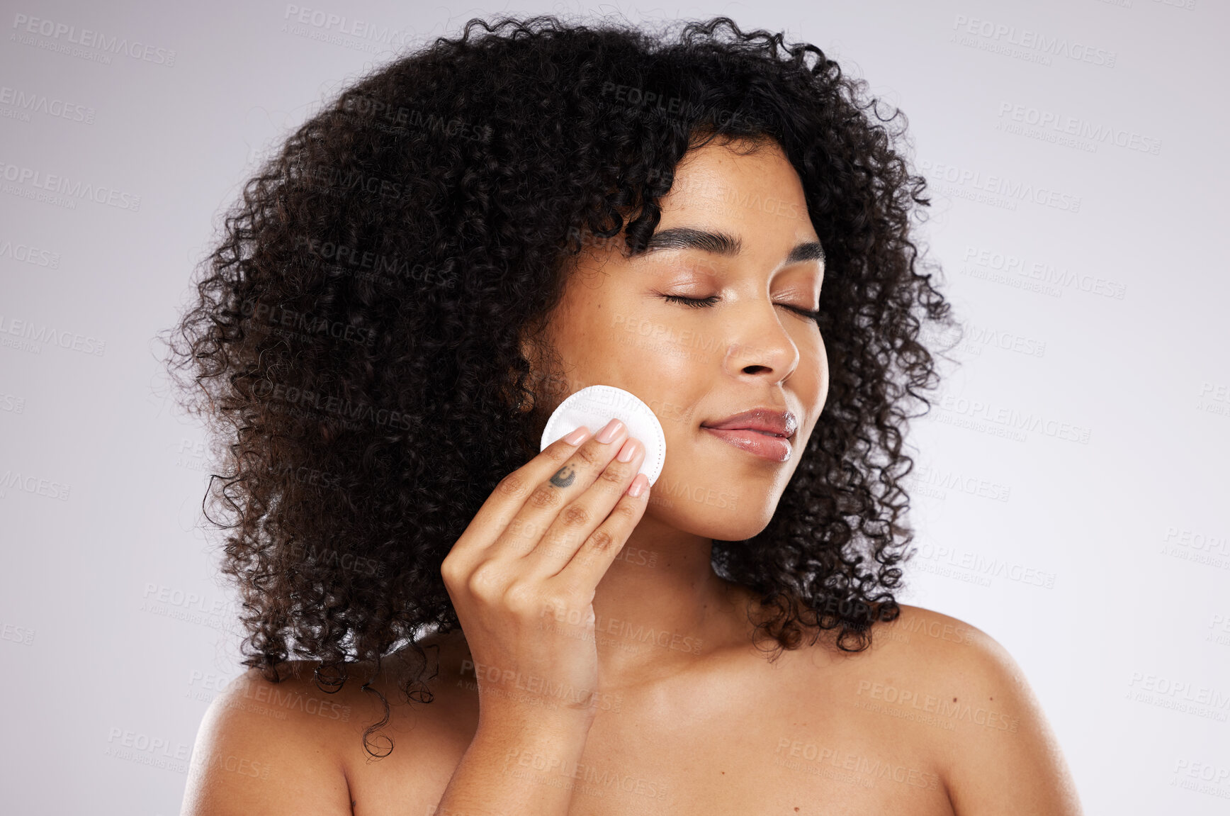 Buy stock photo Beauty, cotton swab and face of black woman for wellness, skincare routine and healthy glow. Dermatology care, luxury spa and girl with pads to remove makeup, cosmetics and facial products in studio