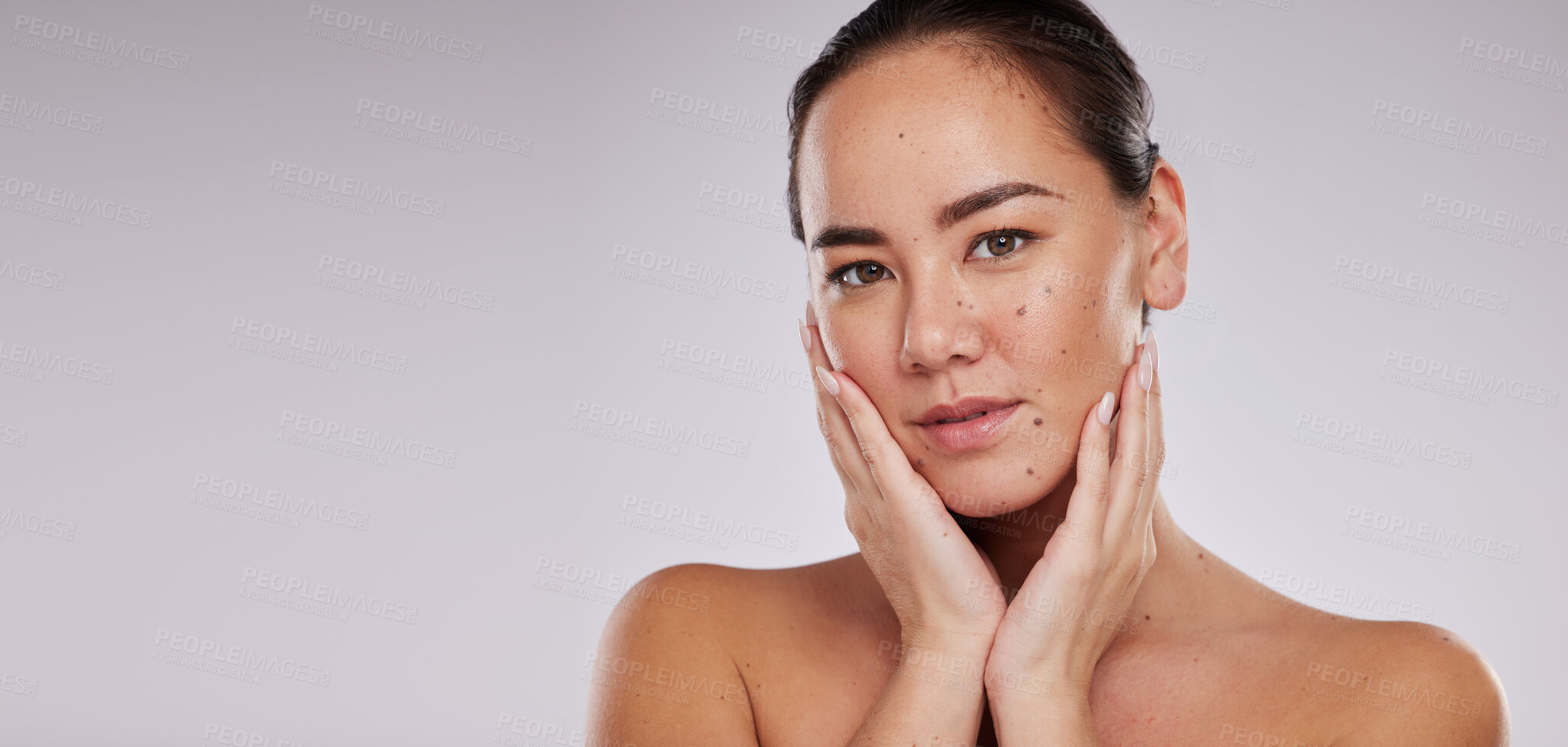 Buy stock photo Skincare, face and portrait of woman with mockup in studio for beauty, dermatology and cosmetics. Aesthetic asian model person with hands for makeup and self care luxury facial on grey background