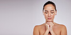 Asian woman, relax and skincare on mockup for cosmetics against a gray studio background. Female model in beauty treatment with closed eyes in relaxation for facial or healthy body care on copy space