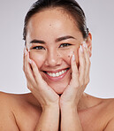 Portrait smile, face and skincare of Asian woman in studio isolated on a gray background. Makeup, beauty cosmetics and happy female model with glowing, healthy or flawless skin after facial treatment