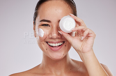 Buy stock photo Skincare, product and face cream with portrait of woman in studio for grooming and cosmetics on grey background. Facial, model and asian girl relax with luxury beauty, skin and sunscreen lotion