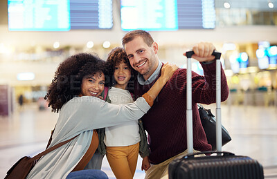 Buy stock photo Happy, interracial and portrait of a family at the airport for travel, holiday and departure. Hug, smile and parents with a child, luggage and hugging affection on a vacation trip leaving together