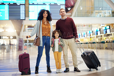 Buy stock photo Family, holding hands at airport and travel for holiday, parents and child look at flight schedule for vacation. Interracial, adventure and people at airline, transportation and journey with luggage