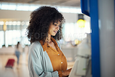 Buy stock photo Black woman, airport and self service kiosk for ticket, registration or online boarding pass. African American female traveler by terminal machine for travel application, document or booking flight