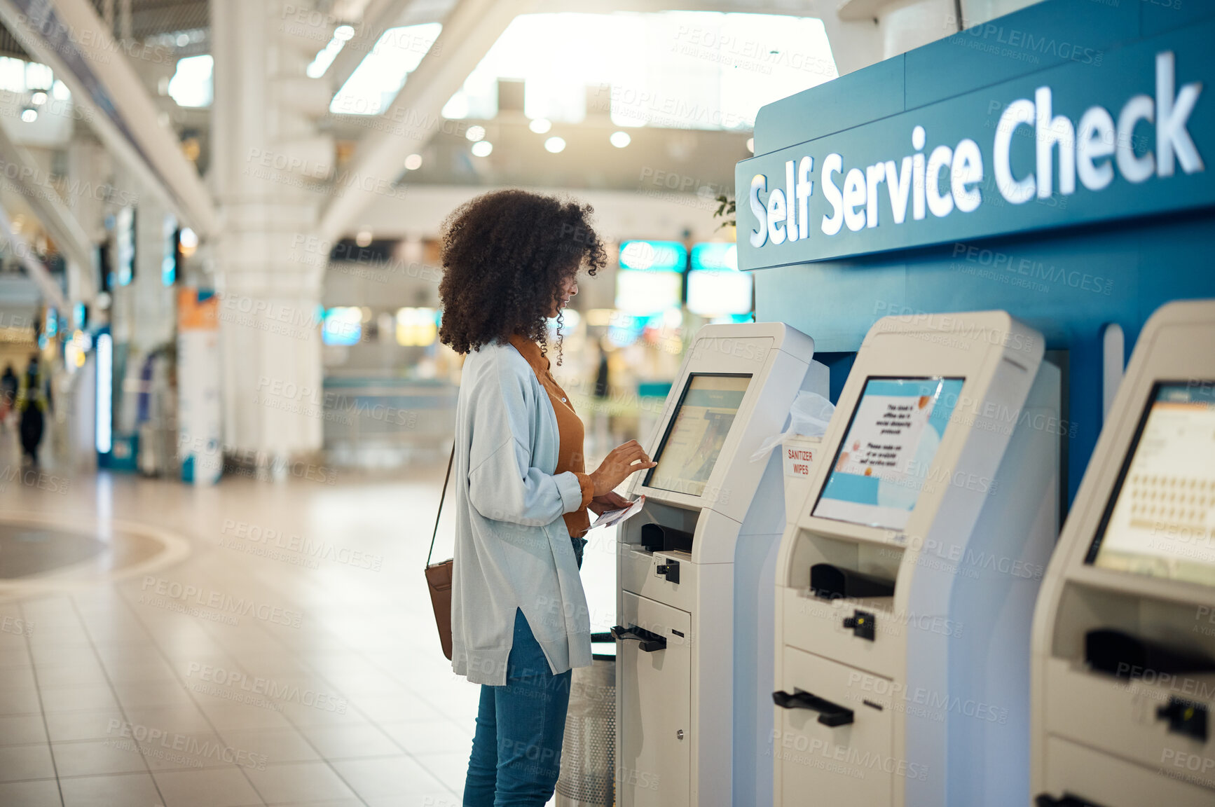 Buy stock photo Black woman, airport and self service kiosk for check in, ticket registration or online boarding pass. African female traveler by terminal machine for travel application, document or booking flight