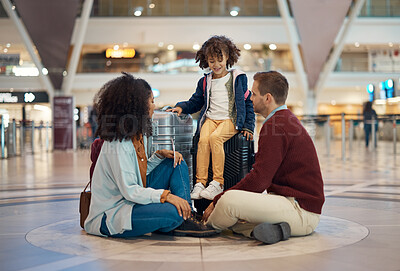 Buy stock photo Family at airport, travel and waiting with luggage, mother and father with child, relax with flight delay and adventure. Terminal, journey and holiday with black woman, man and kid with suitcase