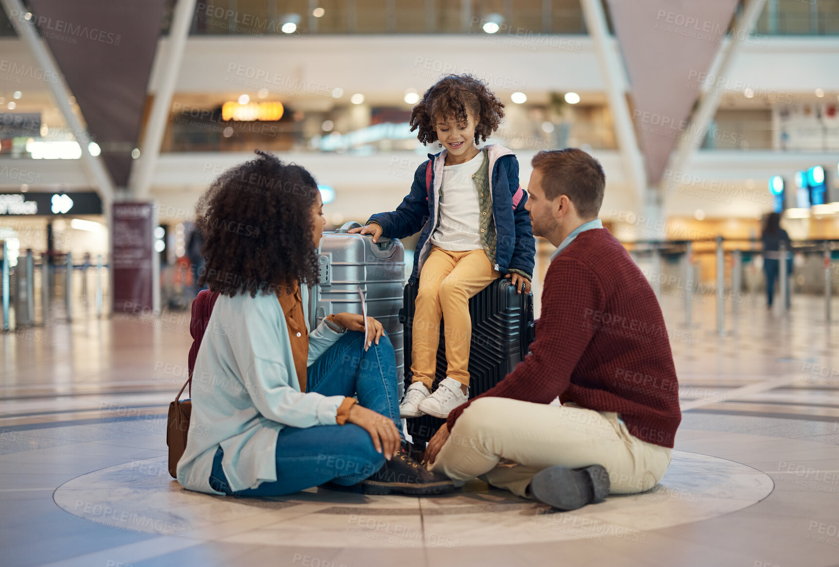 Buy stock photo Family at airport, travel and waiting with luggage, mother and father with child, relax with flight delay and adventure. Terminal, journey and holiday with black woman, man and kid with suitcase