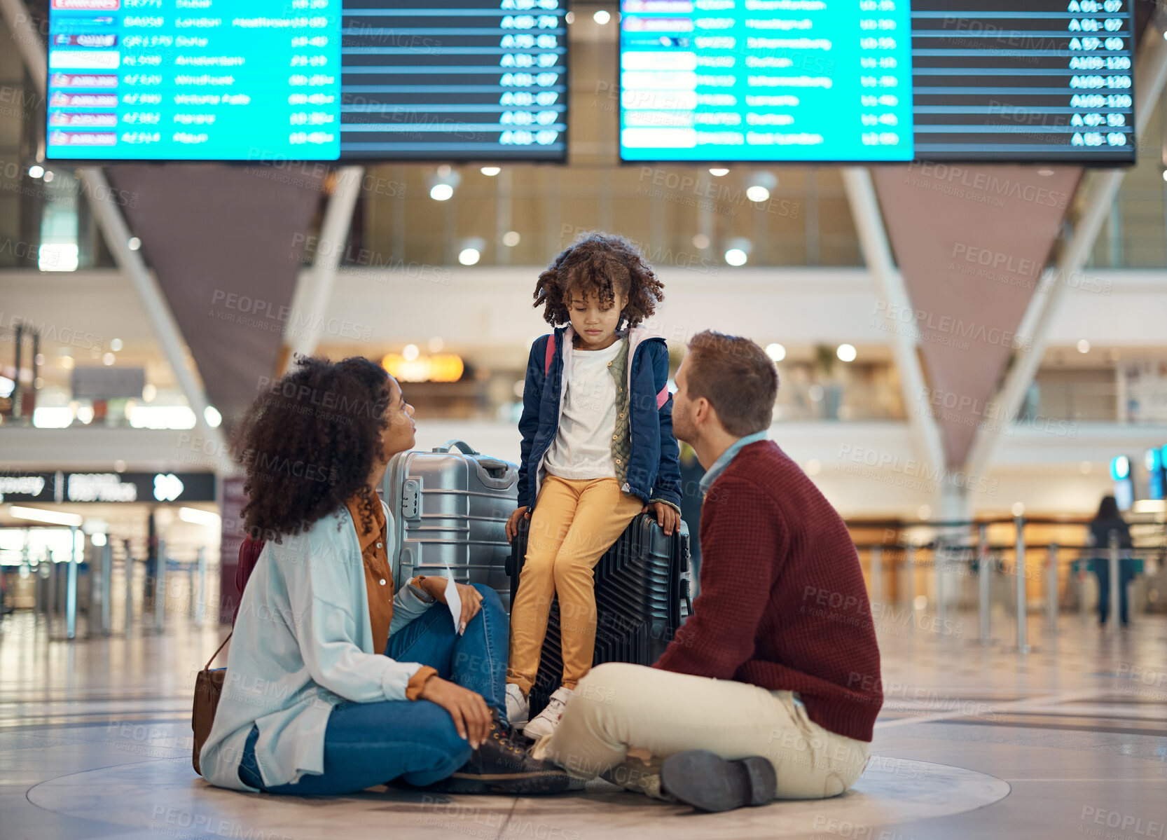 Buy stock photo Family at airport, travel and wait with luggage, mother and father comfort sad child with flight delay and adventure. Terminal, journey and holiday with black woman, man with kid and interracial