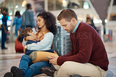 Buy stock photo Phone, tired and interracial family waiting at the airport for a delayed flight. Contact, late and man on a mobile app with a black woman and child sleeping during problems with travel on a trip