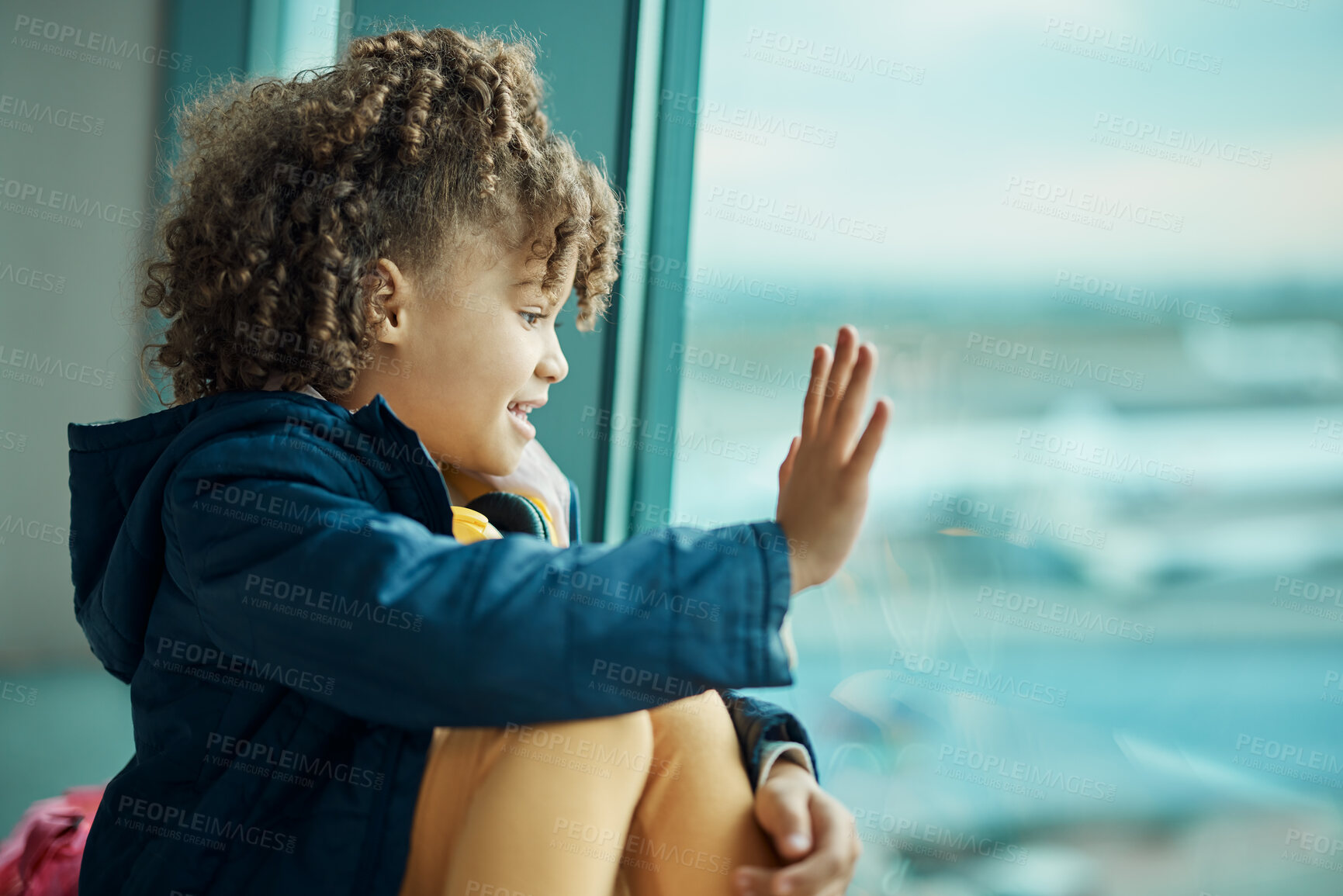 Buy stock photo Girl child, wave and airport window for greeting, goodbye and smile for airplane, international transport and travel. Kid, happy and hand gesture by glass for global immigration, young and African