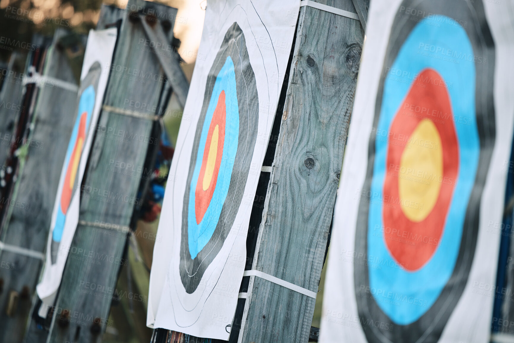 Buy stock photo Bullseye target paper, outdoor and field at shooting range for weapon training, aim and accuracy. Sports, archery and poster for gun, bow and arrow at academy for police, army or security for goal