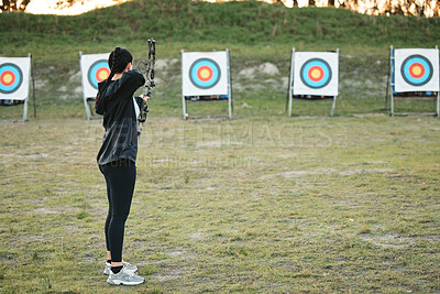 Buy stock photo Sports, archery target and bow and arrow training for archer competition, athlete challenge or girl field practice. Shooting, objective and competitive woman focus on precision, aim or outdoor mockup