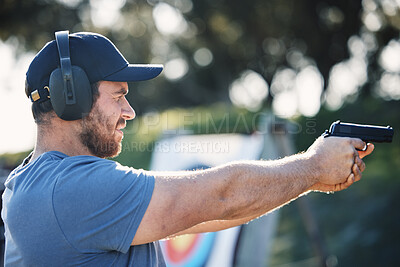 Buy stock photo Man, gun training and target for outdoor challenge, goals and aim for police, army or security academy. Shooting expert, pistol or firearm for sport, safety and combat exercise in nature with vision