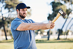 Sports, archery and man throw axe on range for training, exercise and target practice competition. Extreme sport, fitness and male archer aim with tomahawk weapon for action, games and adventure