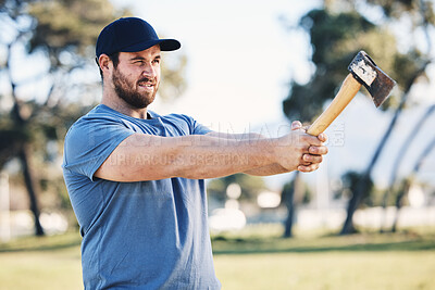 Buy stock photo Sports, archery and man throw axe on range for training, exercise and target practice competition. Extreme sport, fitness and male archer aim with tomahawk weapon for action, games and adventure