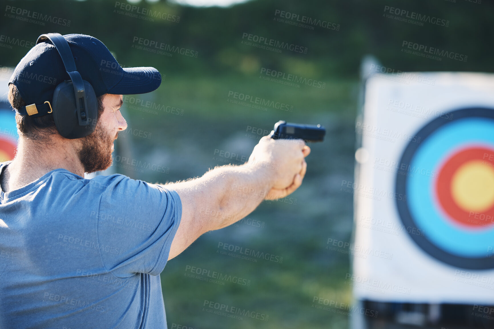 Buy stock photo Man, firearm training and target for outdoor challenge, goals and aim for police, army or security academy. Shooting expert, pistol or gun for sport, safety and combat exercise in nature with vision