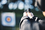 Gun, target and person training outdoor for shooting range, game exercise or sports event closeup. Hands with firearm and circle for aim, vision and practice, police learning academy or field gaming