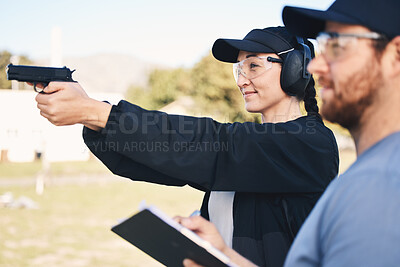 Buy stock photo Gun range, target practice and woman holding a rifle for safety, security and police training. Field, exercise, and learning to fire at a outdoor academy with mentor and shooting gear for challenge 