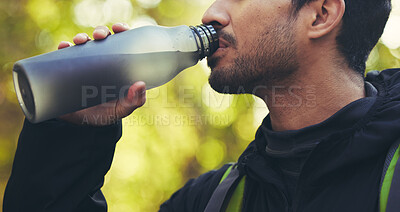Buy stock photo Man, hiking or drinking water in nature forest, woods or fitness environment for break, electrolytes or healthcare wellness. Hiker, backpacker or sports bottle for rest, recovery or thirsty workout