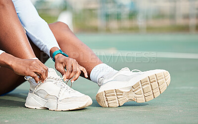 Buy stock photo Woman, hands and tying shoes on court for sports preparation, training or workout exercise in the outdoors. Hand of female tie shoe on foot getting ready for sport game, match or competition outside