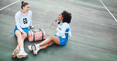 Buy stock photo Netball, friendship and girls talking outdoor after a match, training or exercise on the court. Happy, friends and female athletes laughing, speaking and bonding together after a game or practice.