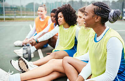 Buy stock photo Sports, netball and team talking on the court while resting after a match or training. Collaboration, conversation and female players or athletes sitting on ground and speaking after game or practice