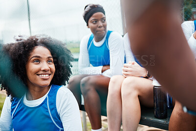 Buy stock photo Sports, netball and women with smile talking, planning and sitting on stand for game, match and practice on court. Fitness, teamwork and happy female athletes for exercise, training and competition
