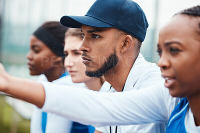 Buy stock photo Sports, people and group of man and women watching a match together at a field, focus and concentration. Diversity, team and athletes relax during training, game and performance at outdoor court
