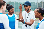 Coach, strategy and collaboration with sports people listening to tactics or instructions on a court. Fitness, team and planning with a black man talking to a group of girls during a competition 