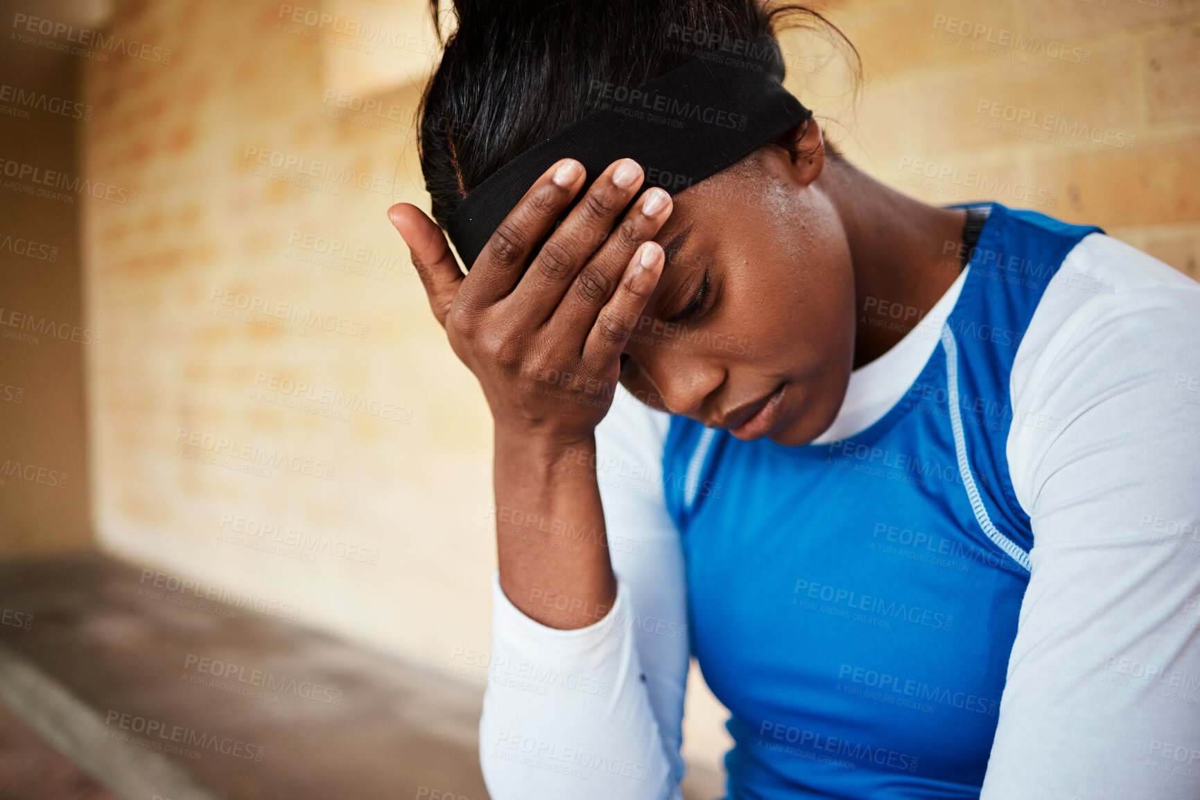 Buy stock photo stress, headache and black woman with anxiety during fitness, routine or training against a brick wall background. Athletic, audition and girl with mental health issue, nervous and worried at stadium