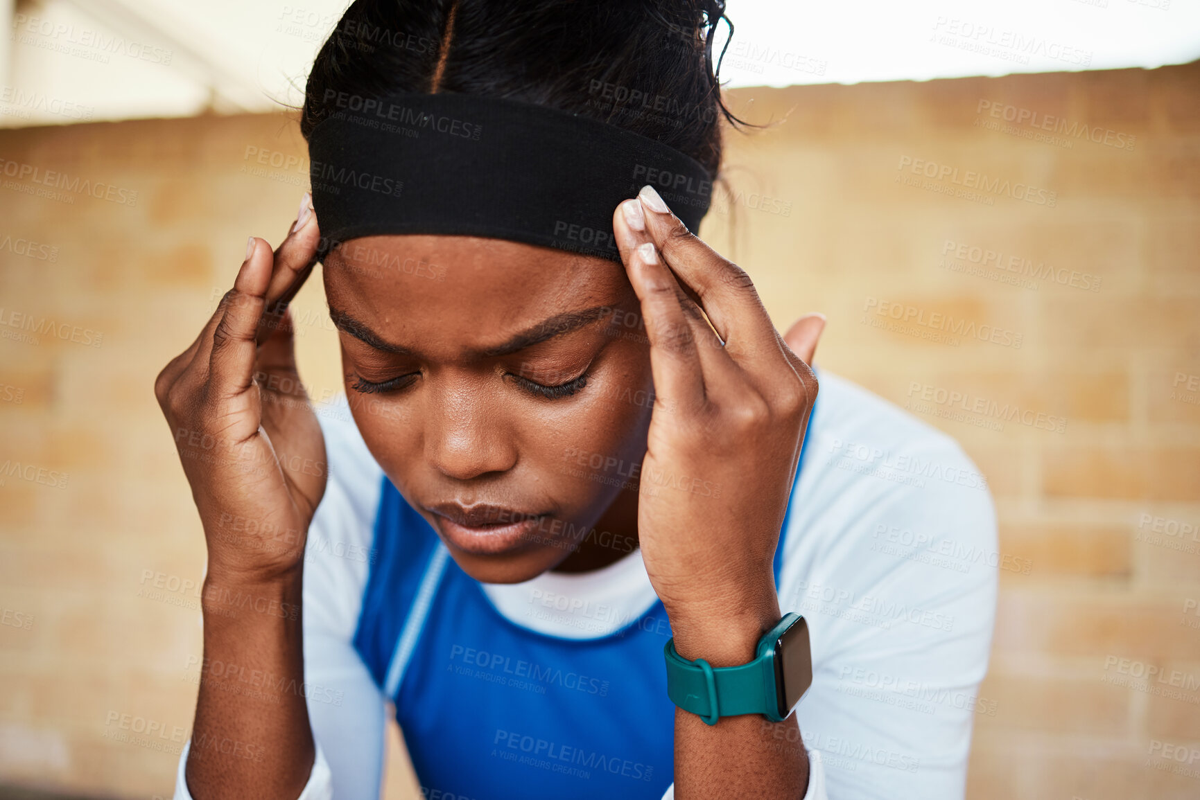 Buy stock photo Fitness, headache and black woman in pain during run, exercise or workout against brick wall background. Sports, migraine and girl suffering with ache, discomfort and fatigue during cardio routine 