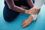 Injury, hurt and foot or ankle pain for athlete getting help from coach, trainer and sport or gymnastics practice. Person, emergency and closeup of people feet swollen muscle due to exercise accident