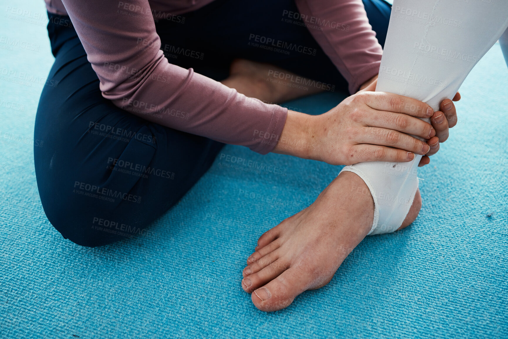 Buy stock photo Injury, hurt and foot or ankle pain for athlete getting help from coach, trainer and sport or gymnastics practice. Person, emergency and closeup of people feet swollen muscle due to exercise accident