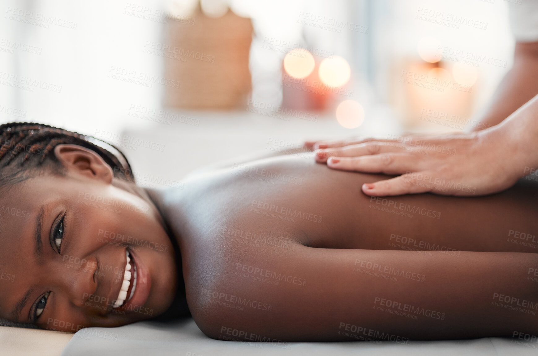 Buy stock photo Black woman, smile and back massage at spa in relax for physical therapy, zen or stress relief at resort. Happy African American female smiling relaxing for healthy wellness, body care or treatment