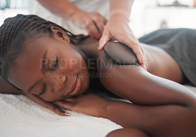 Buy stock photo Black woman gets hot stone massage, spa and hands of masseuse, holistic and wellness physical therapy. Health, peace with face and self care with zen, stress relief for people and back skin detox