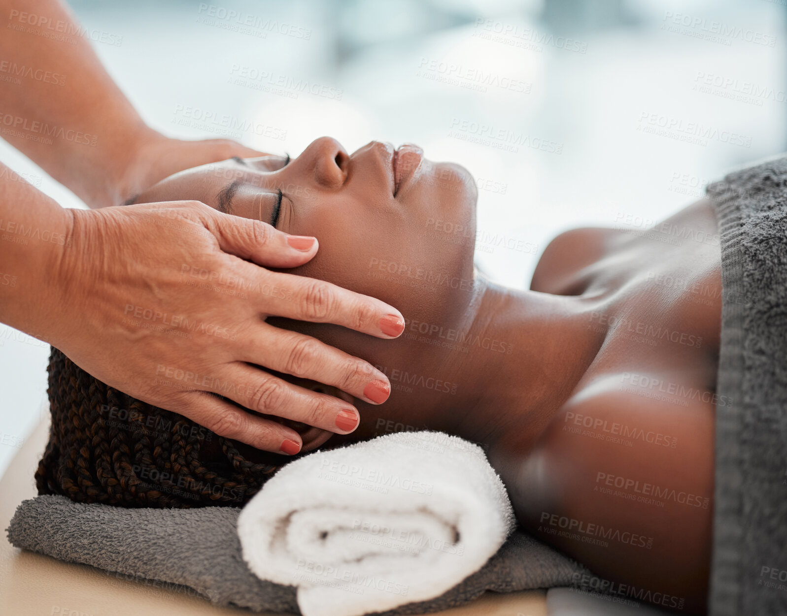 Buy stock photo Face massage, spa and black woman with skincare wellness, peace and calm for luxury treatment. Facial therapist and hands for beauty, zen and healing, stress relief and african person relax on table