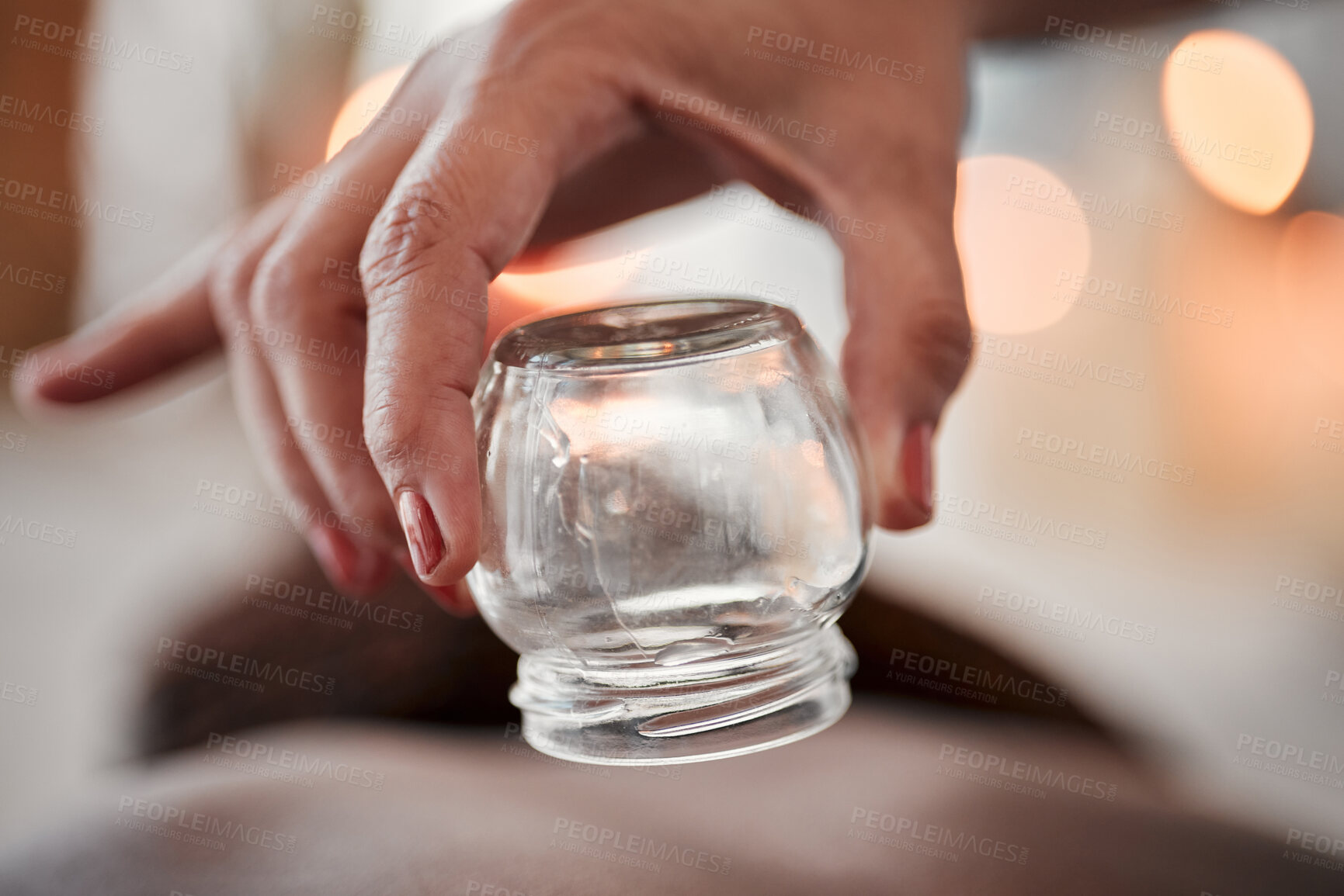 Buy stock photo Cupping therapy, glass vacuum cup in hand and woman at spa, therapist with deep tissue massage and wellness. Closeup, treatment at luxury resort with cosmetic, body care and health with acupuncture