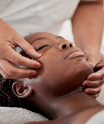 Buy stock photo Black woman face, massage and spa wellness therapist  with young female and cosmetic facial. Skincare, beauty and dermatology clinic with client feeling calm and zen from hyaluronic acid serum