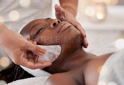 Buy stock photo Black woman, gua sha massage and luxury face treatment of a young female with spa facial. Skincare, rose quartz tool and beauty in wellness clinic with client feeling calm and zen from dermatology