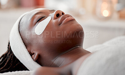 Beauty, relax and eye mask with black woman in spa for skincare, facial treatment and wellness. Health, peace and luxury with girl and face product for cosmetics, dermatology and hospitality