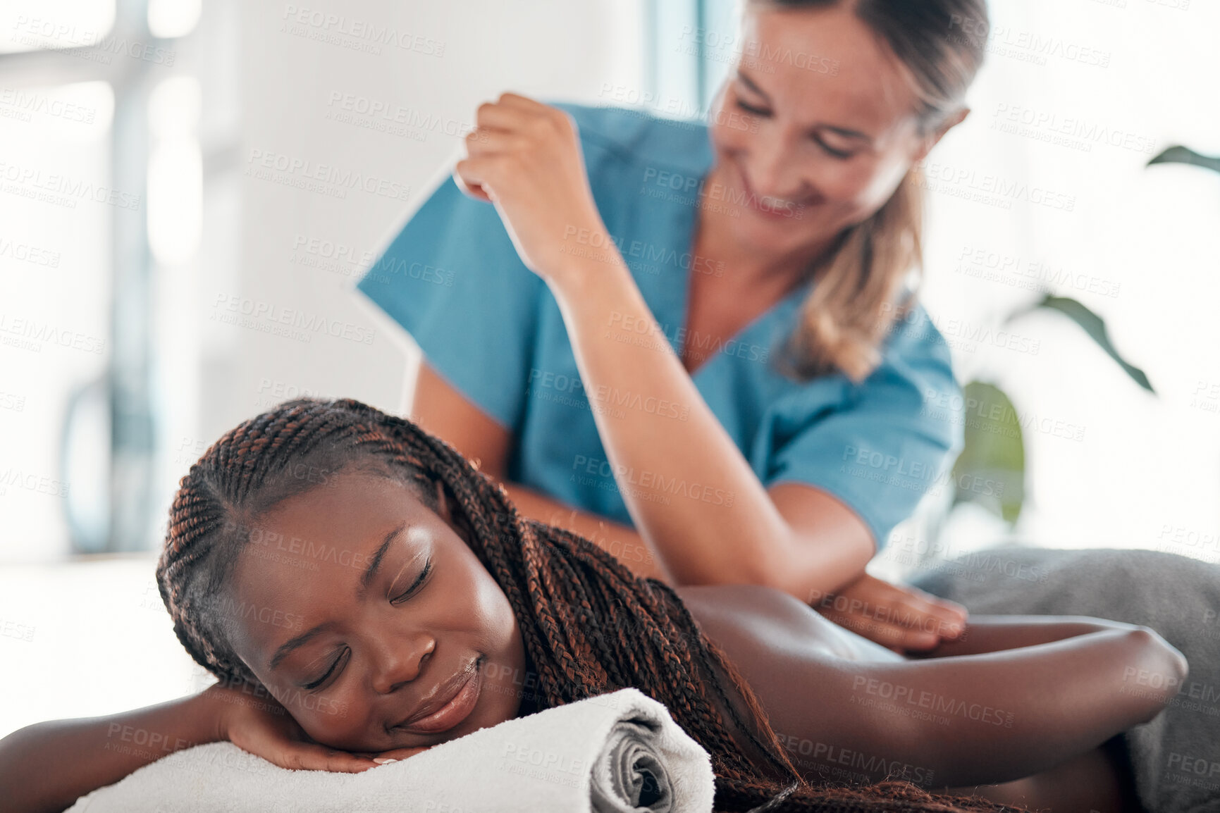 Buy stock photo Black woman, bed and smile for spa back massage, treatment or relaxation in stress relief at resort. Happy African American female relaxing with masseuse massaging with elbow for physical therapy
