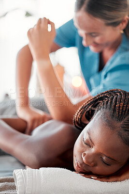 Buy stock photo Black woman, bed and relax for spa back massage, deep tissue or relaxation in stress relief at resort. Happy African American female relaxing with masseuse massaging with elbow for physical therapy